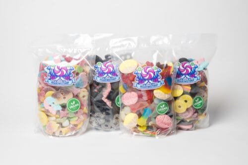 Vier Assortizakken veggie snoep van VeggieSweetshop naast elkaar